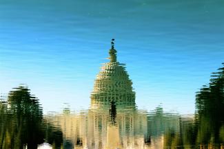 a water reflection of the Congress building
