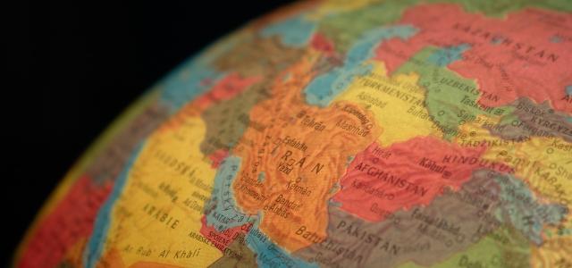 a map of Iran appearing on a globe