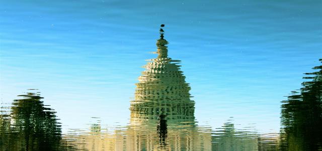a water reflection of the Congress building
